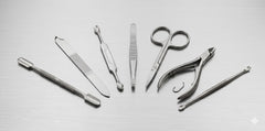 Set of dental tools on a light gray background
Manicure kit, nail grooming set, professional manicure tools, pedicure kit, stainless steel nail tools.

 Cuticle nippers, nail file, tweezers, manicure scissors, cuticle pusher.

Professional nail care, home manicure, travel grooming kit, portable nail set, precision grooming.

Durable stainless steel, premium grooming tools, travel-friendly case, salon-quality, matte black finish.
